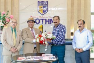 COTHM CEO Ahmad Shafiq presenting flowers to General Nasee Khan from Fauji Foundation.